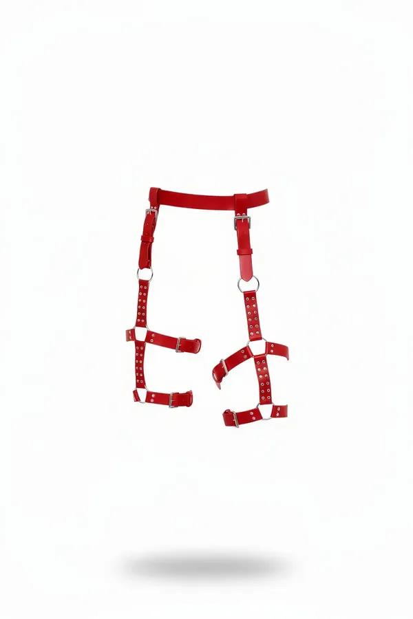 red faux leather leg harness with silver O-rings and adjustable buckle straps covering both thighs
