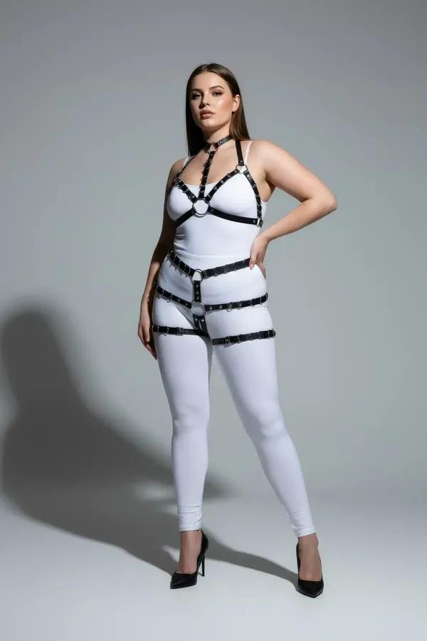 black faux leather full body harness with choker collar O-ring chest straps and upper thigh leg garters on plus-size model