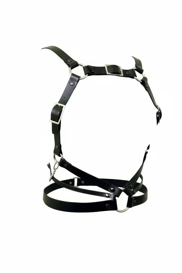 black faux leather full body harness with silver O-rings and rectangular buckles, open midriff frame, white background