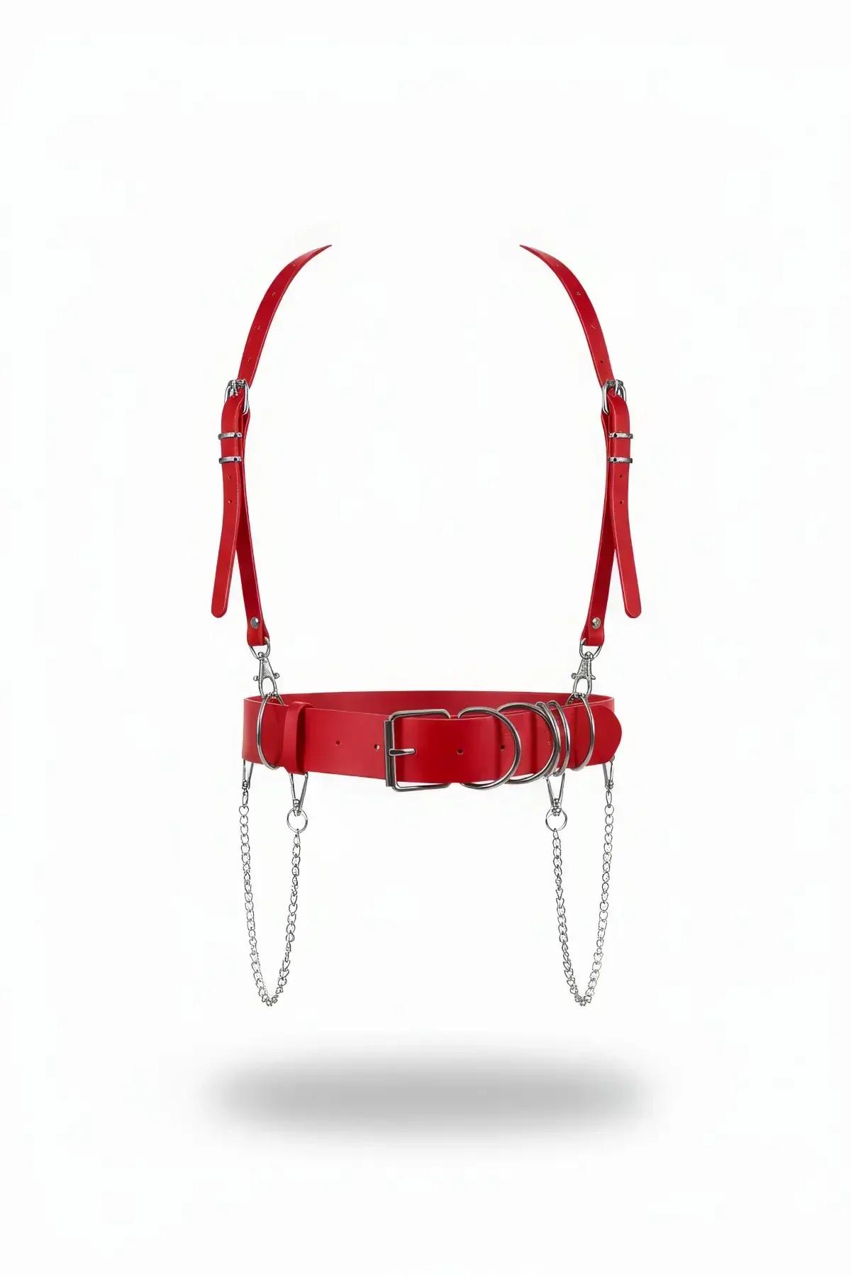 Red faux leather waist harness with silver O-rings, dual draped chains, and adjustable shoulder straps on white background