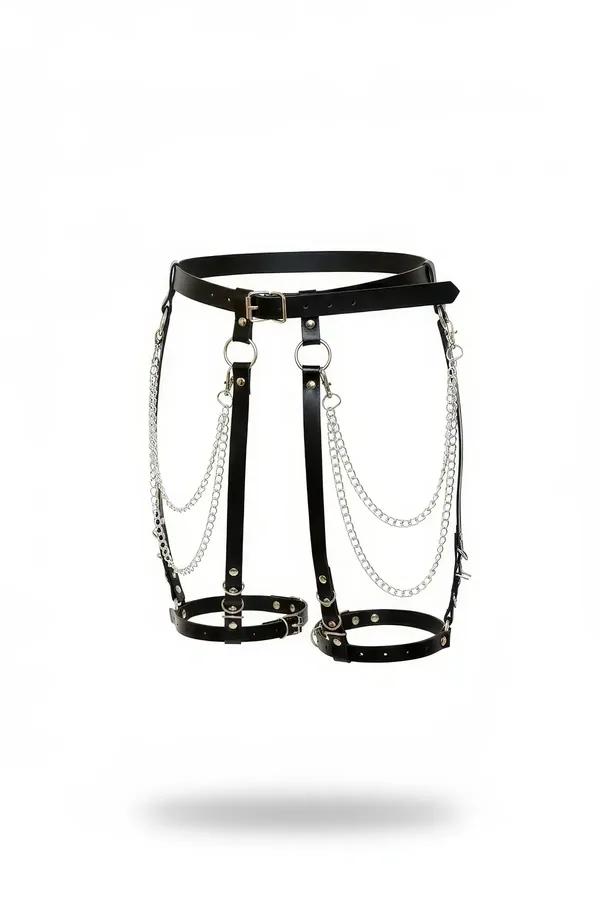 black faux leather garter harness with draped silver chains, dual o-rings, rivet studs, and adjustable thigh rings on white b