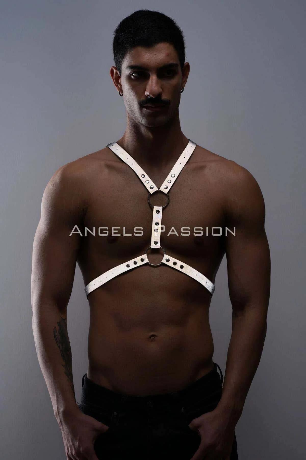 White reflective faux leather chest harness with dual stacked silver O-rings and eyelet rivet detailing, worn by male model