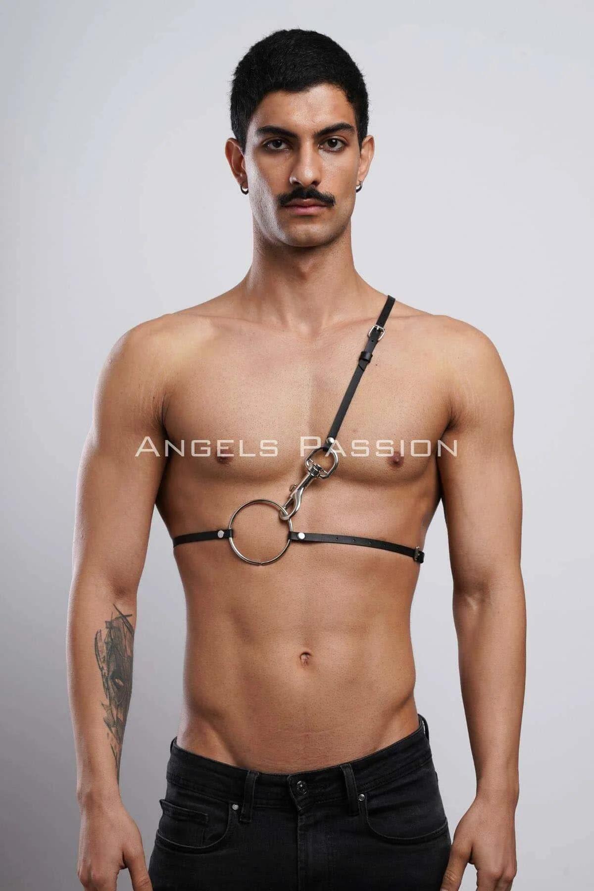 black faux leather O-ring chest harness with single adjustable diagonal shoulder strap on male model