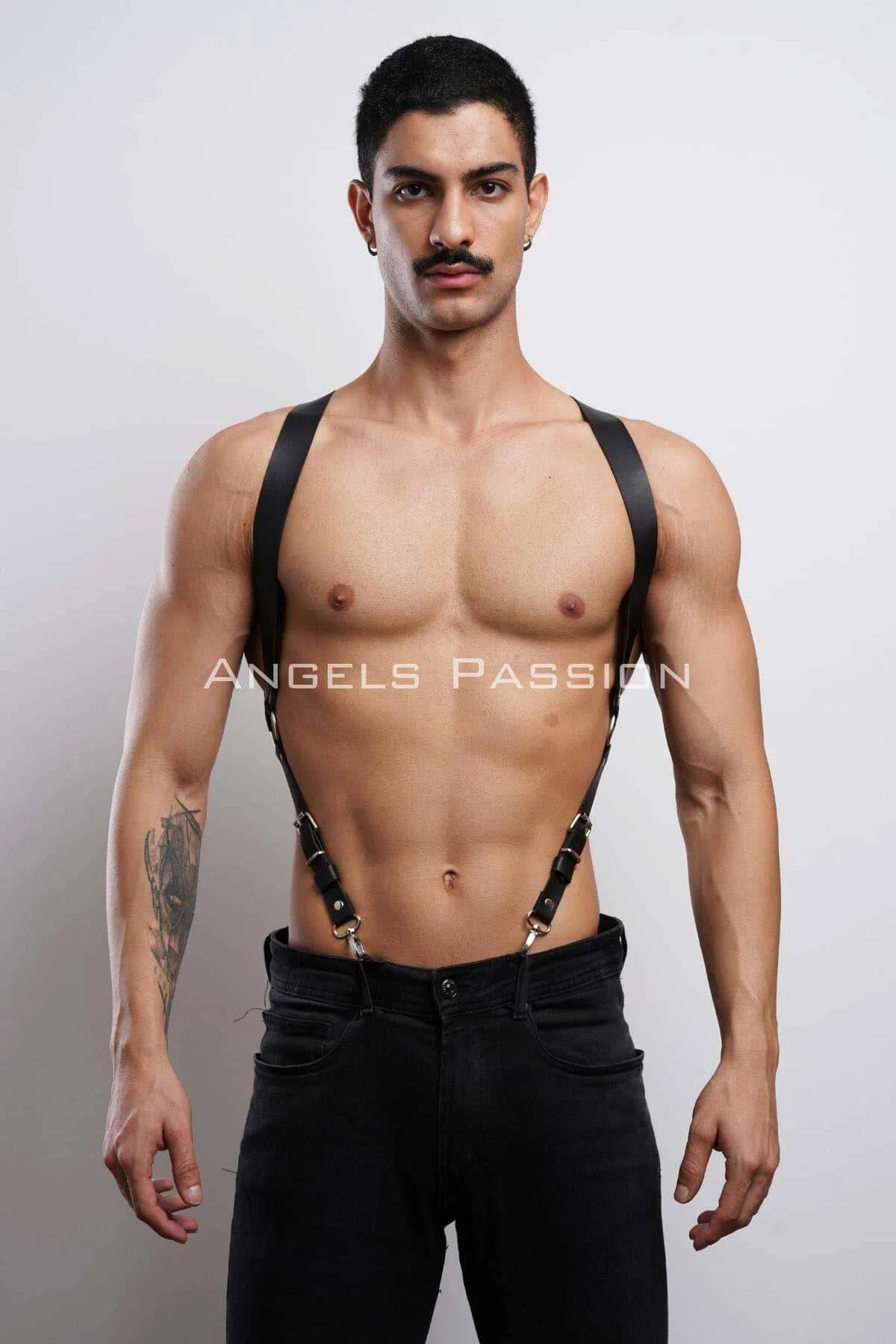 Black faux leather shoulder harness men suspender style silver metal clips worn over bare torso