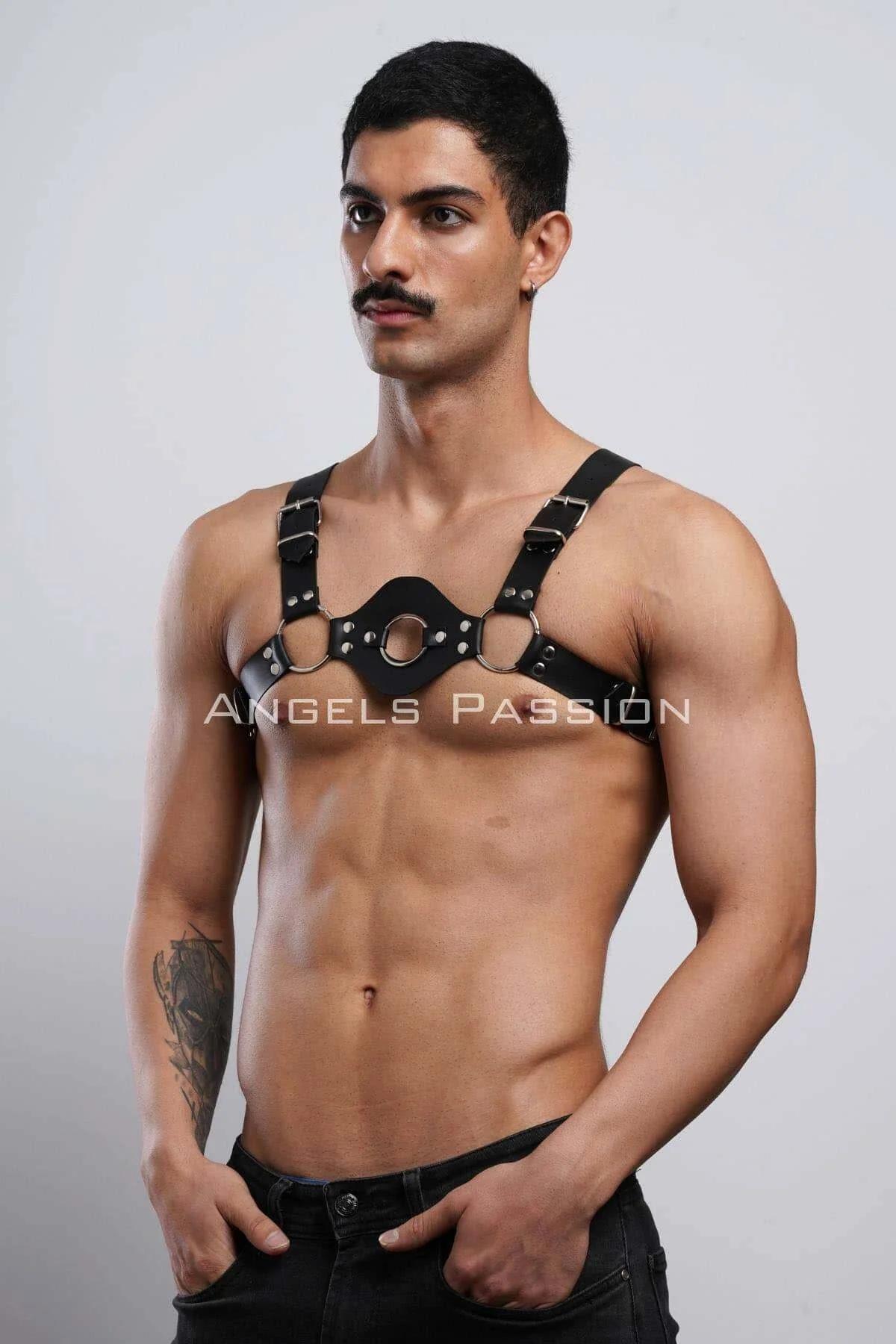 black faux leather chest panel harness with triple O-rings and silver buckle shoulder straps worn by male model