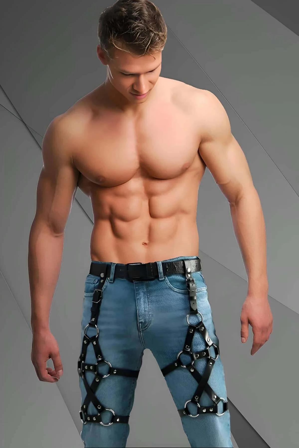 black faux leather leg harness with silver O-rings worn over light blue jeans, adjustable thigh straps and buckles