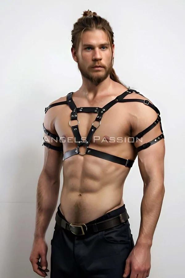 black faux leather strappy o-ring chest harness with silver hardware on male model front view