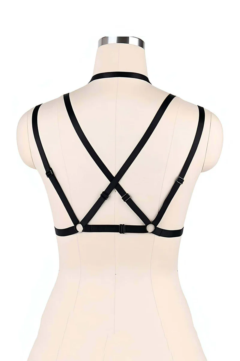 Black faux leather harness styled with a skirt