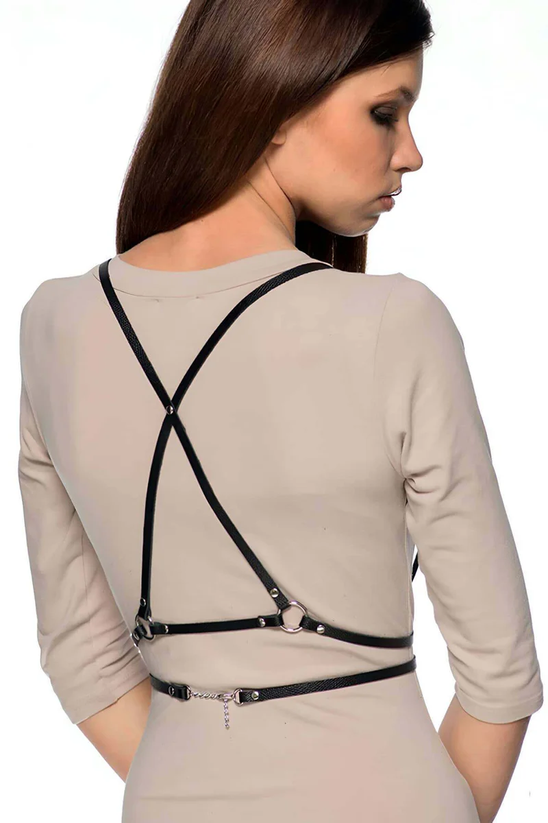 Black faux leather chest harness front view with adjustable straps and metal rings