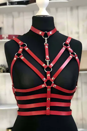 Red faux leather body harness with detachable choker and O-ring accents, front view