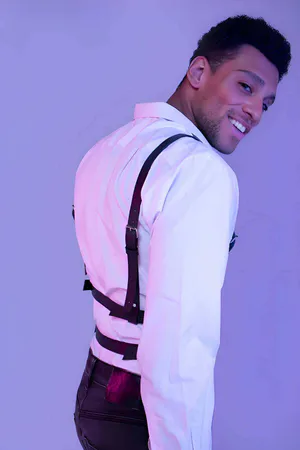 Black Faux Leather Chest Harness with Silver O-Rings worn over white shirt