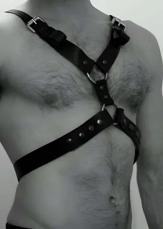 Black Faux Leather Adjustable Chest Harness with O-Rings and Silver Buckles on Male Torso