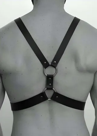Black Faux Leather Adjustable Chest Harness with O-Rings and Silver Buckles on Male Torso