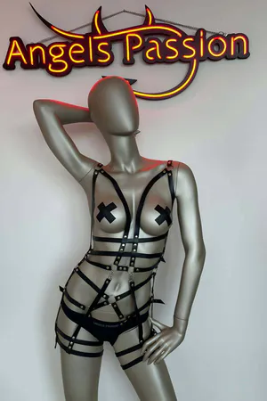 Black faux leather full body harness with adjustable straps and O-ring detail