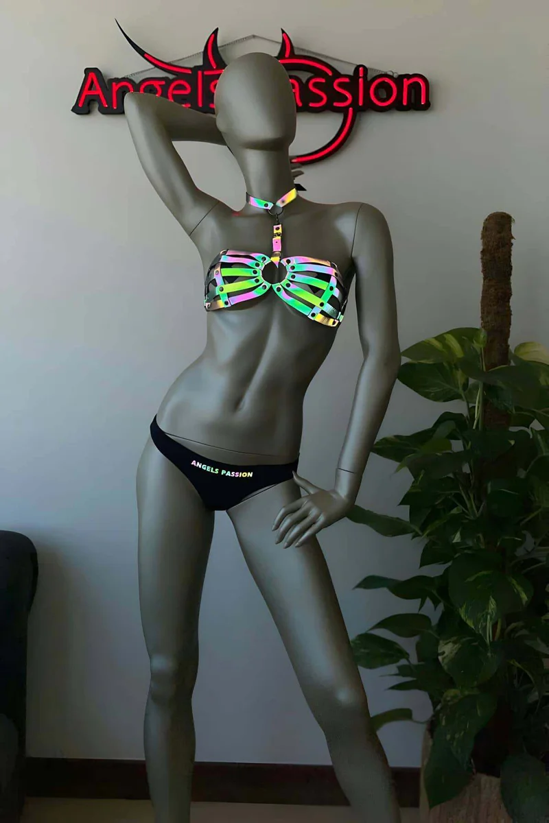Close-Up Iridescent Material Texture Under Light Shifting Colors on Caged Chest Harness Top with Rainbow Straps and Central