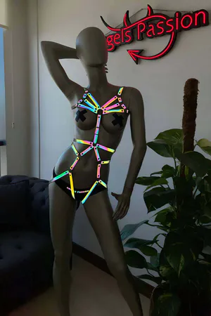 Reflective rainbow full body harness on mannequin with adjustable straps