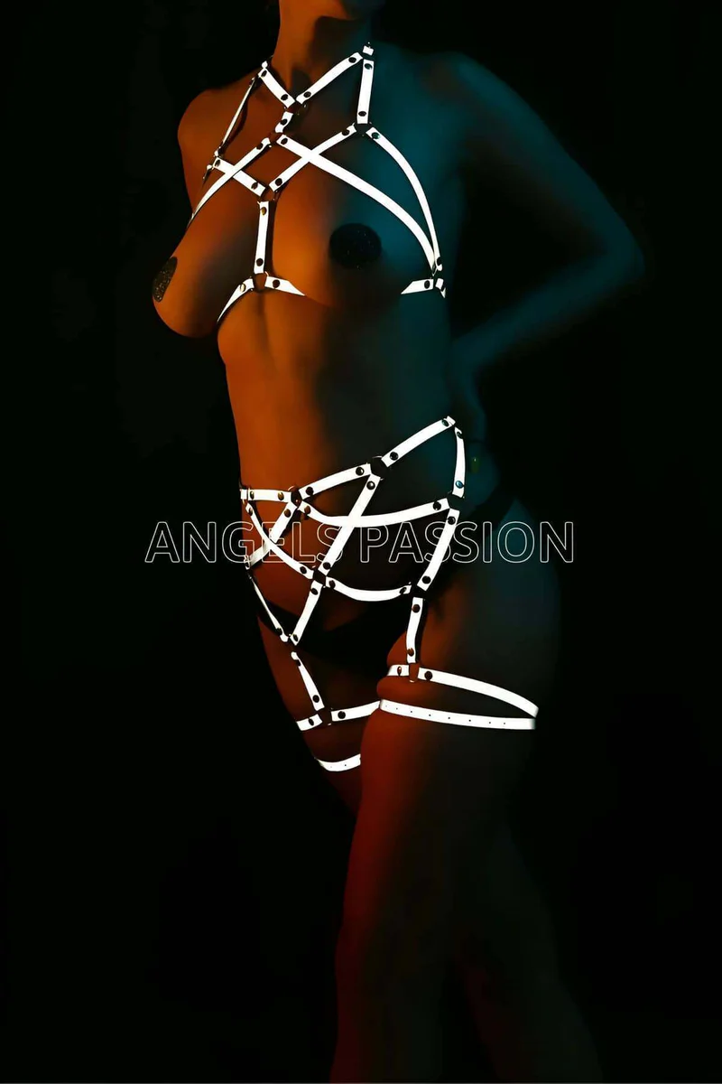 Reflective harness straps set showing metal stud detail on chest and thigh straps