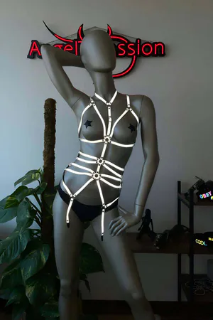 Reflective full body harness with O-ring accents in silver on a mannequin