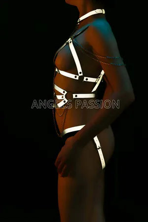 Reflective full body harness with adjustable straps and silver chain details