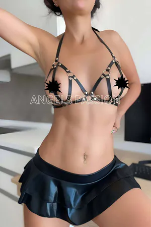 Black faux leather strappy bra harness with silver O-ring accents