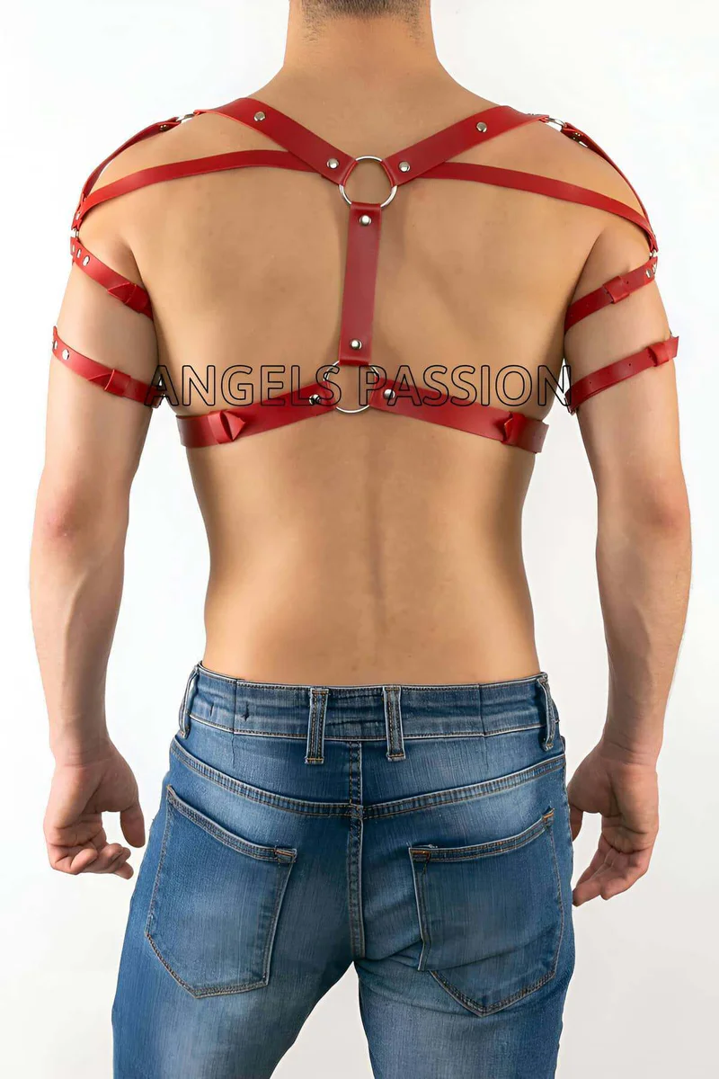 Red faux leather shoulder harness detail with arm straps and silver rings
