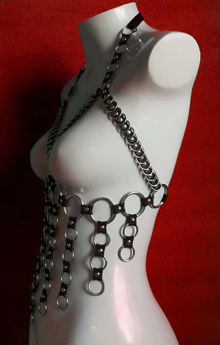 Side profile of faux leather body harness with cascading O-ring chains