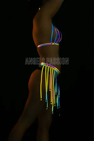 Reflective halter top and tassel skirt set with rainbow colors.