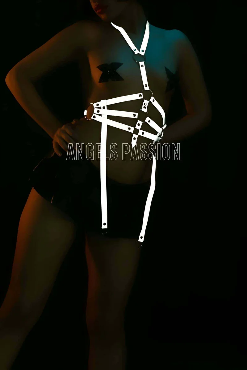 Model wearing reflective body harness from side view with straps and o-rings