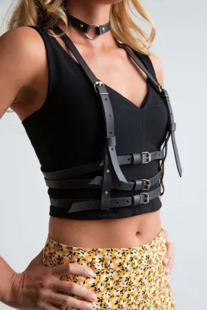 Black faux leather strappy body harness with choker on model