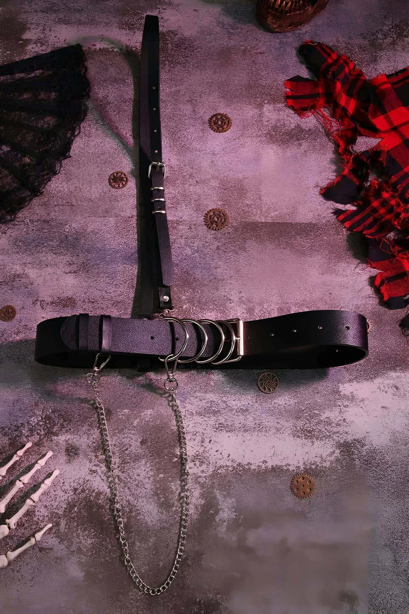 Close-Up of D-Ring Closure and Lobster Clasp on Black Faux Leather Harness