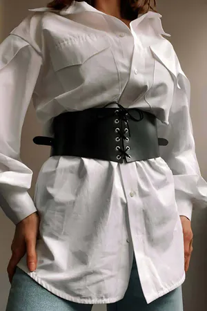 Black Faux Leather Corset Waist Belt with Front Lacing over White Shirt
