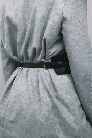 Black Faux Leather Corset Waist Belt with Front Lacing over White Shirt