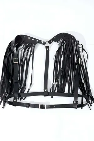 Black faux leather body harness with dramatic fringe shoulder straps and silver buckles.