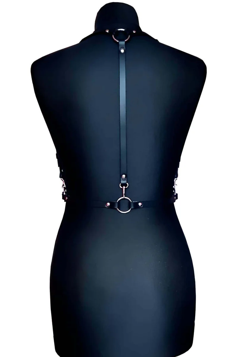 Back view of black faux leather chest harness showing adjustable strap system