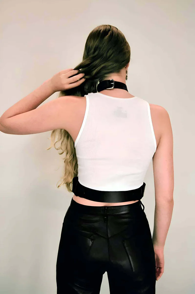 Side view of adjustable black vegan leather body harness waist belt