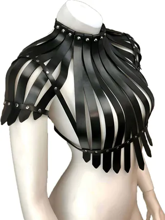 Black faux leather statement shoulder harness with cascading fringe detail and studded shoulder caps.