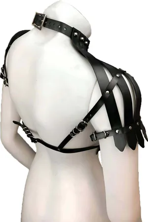 Black faux leather statement shoulder harness with cascading fringe detail and studded shoulder caps.