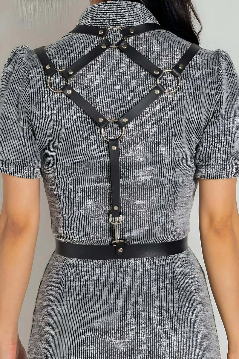 Black faux leather adjustable body harness belt with silver hardware detail