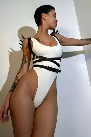 Black faux leather winged body harness on model