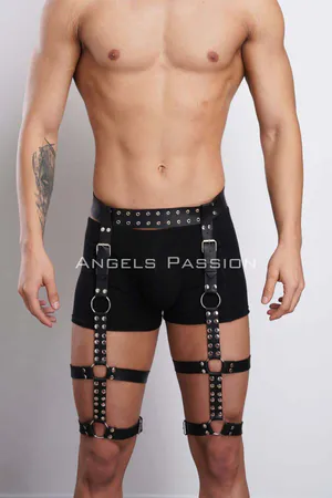 Black faux leather leg harness with metal studs and O-ring garters