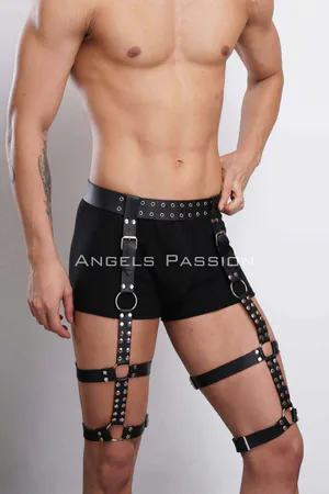 Black faux leather leg harness with metal studs and O-ring garters