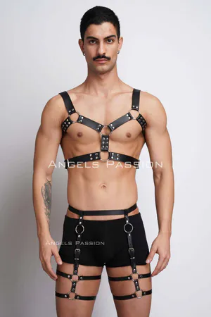 Black faux leather full body harness with O-ring accents and adjustable straps.
