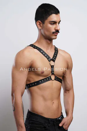 Black faux leather studded chest harness with O-ring details