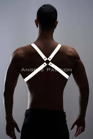 Reflective chest harness with adjustable straps worn by a man