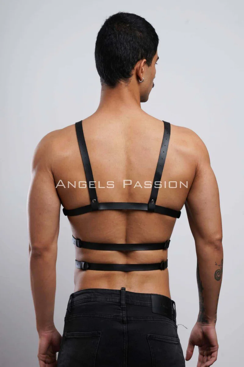 Flat Lay of Black Chest Harness with Silver Hardware and Storage Pouch