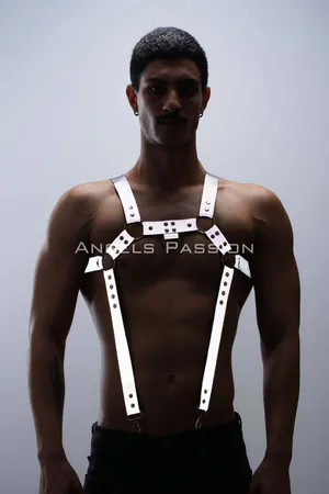 Reflective chest and trouser harness set worn by a person, showing silver straps with reflective elements