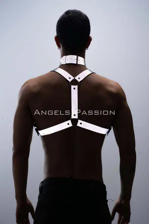 Silver reflective body harness and choker set worn by a man
