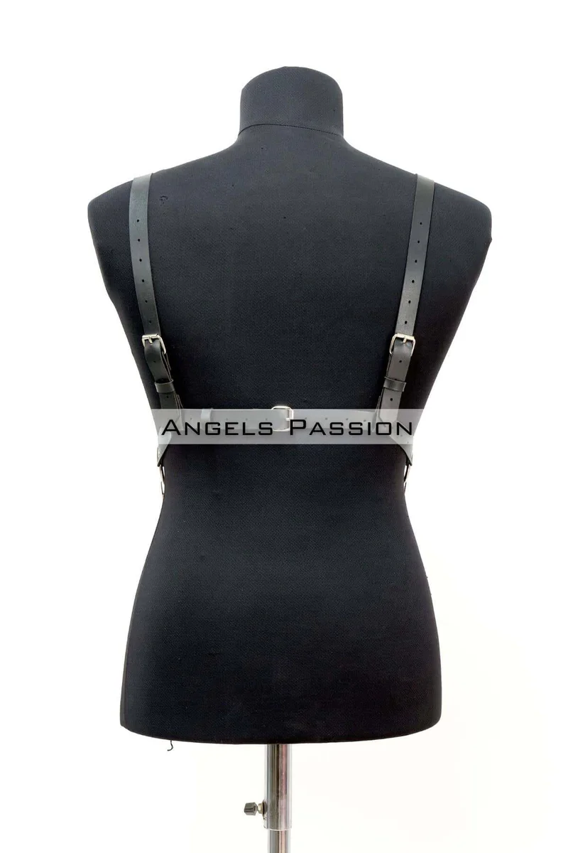 Black pentagram body harness with chain detail visible at waist