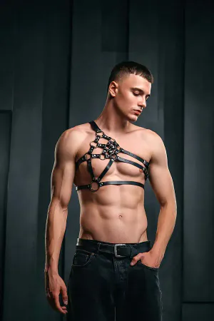 Structured black faux leather body harness with O-ring detail on model
