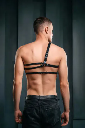 Structured black faux leather body harness with O-ring detail on model